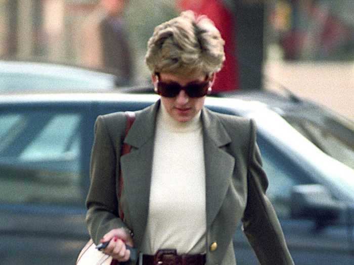 While out shopping in October 1994, Princess Diana looked sophisticated in belted white pants, a simple turtleneck, and an olive green blazer.