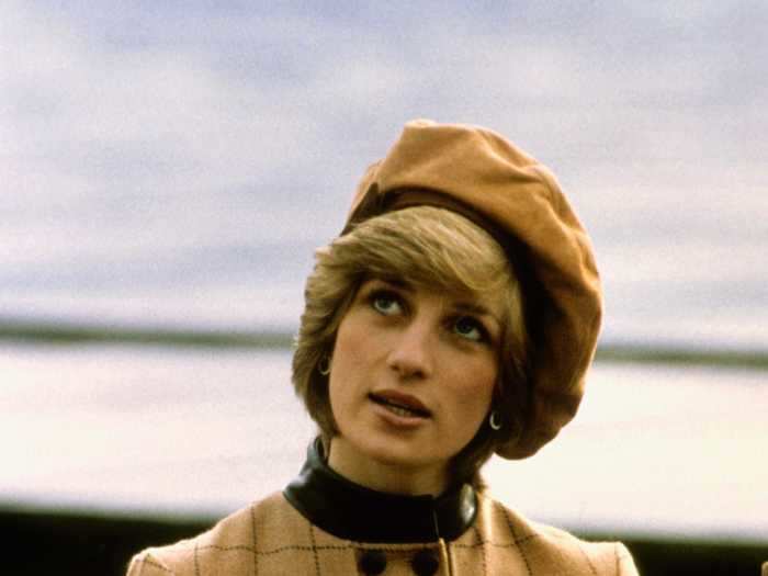 Princess Diana looked effortlessly chic in this collared, plaid tan coat with a matching hat.