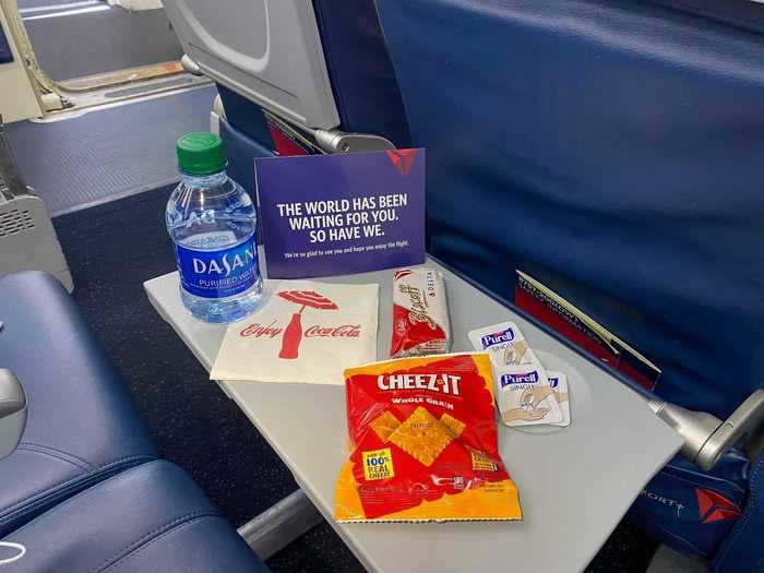 Once in the air, the in-flight service has also been augmented as flight attendants now pass around a snack bag with a water bottle, two snacks, a napkin, and more packets of Purell.