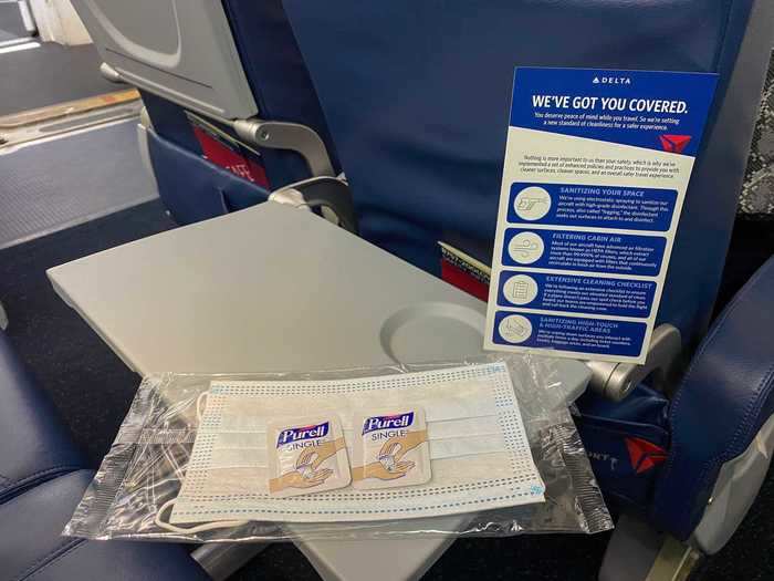 Inside the mask kit is a disposable mask, two single-use Purell packs, and an explainer on Delta