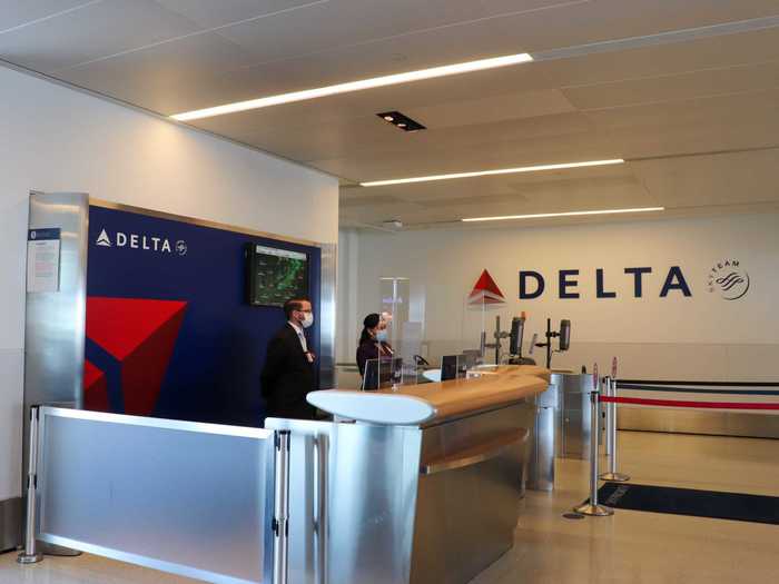 The gate area then mirrors the check-in area as Delta has installed plexiglass partitions at the counter...