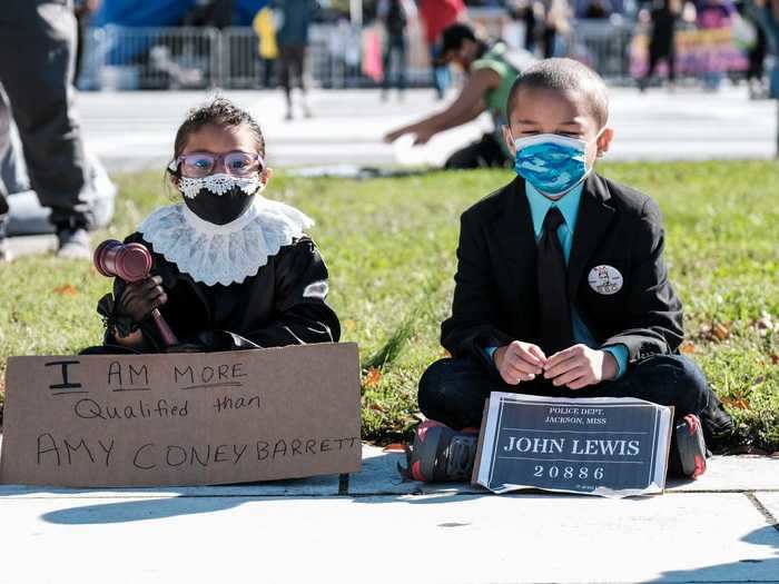 Children also took part in the march, with some dressed up as and paying homage to the late Ginsburg and Rep. John Lewis.