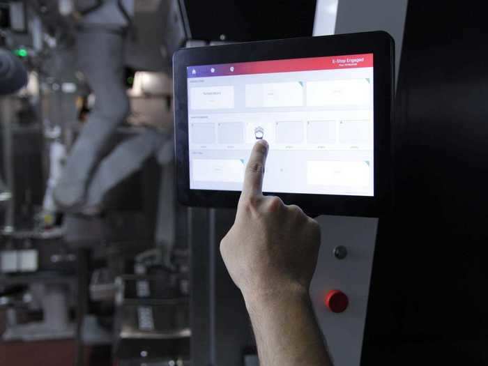 A monitor on the robot tells the staff what orders are up next, and staff can also adjust cooking times here for custom orders.