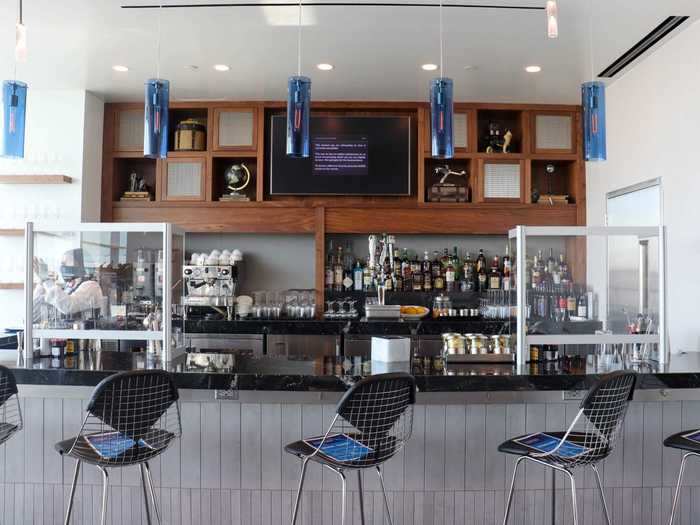 Plexiglass partitions are featured at each bartender station but all the barstools have been blocked to prevent crowding in the area.