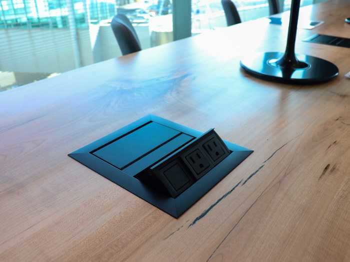 The conference room table, like most seating areas in the lounge, is peppered with pop-up power outlets and USB charging ports.