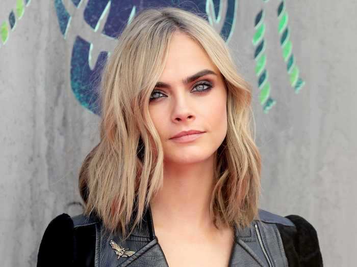 Cara Delevingne typically has shoulder-length blonde hair.