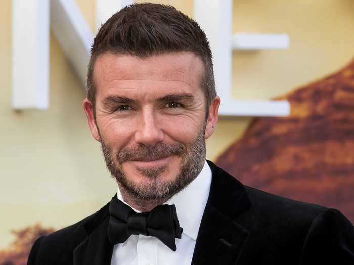 David Beckham has thick hair that he usually swoops up on his head.