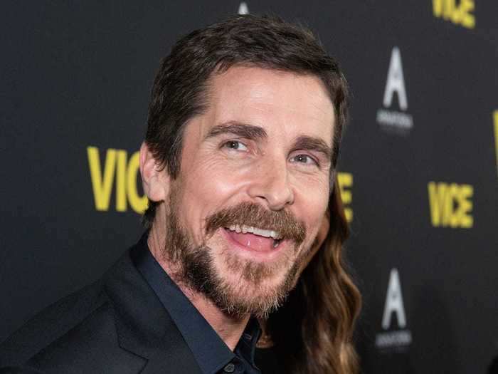 Christian Bale has tousled brown hair that is sometimes on the longer side.