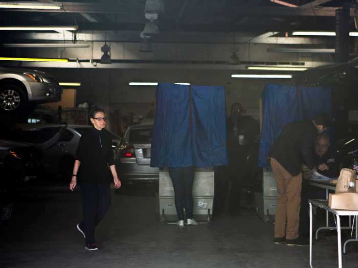 People voted in the 2016 presidential election as mechanics worked on cars at a Philadelphia auto shop.