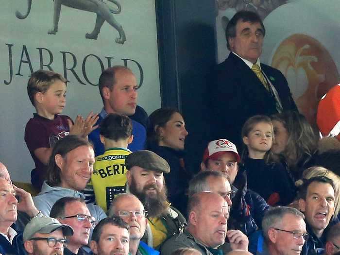 He gets pretty invested in sports. Here he is watching a soccer match with his wife and children ...