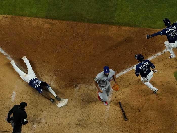 Thanks to not one, but two terrible defensive miscues on the final play of the game, Arozarena came home to score the game-winning run, tying the World Series at two games apiece.