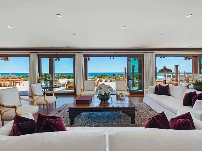 The living room takes full advantage of these views with floor-to-ceiling doors and windows that look out at the ocean, according to the Compass listing.