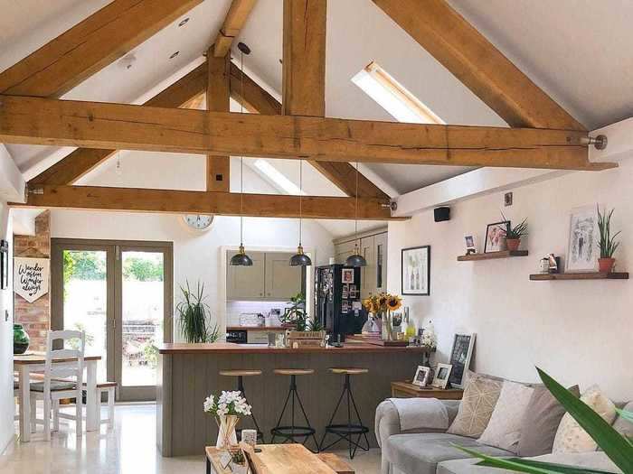 Exposed oak beams in the living room and kitchen let visitors know that the home was, in fact, once a barn.