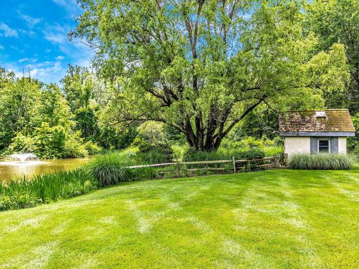 The home sits on 5.89 acres of land and has a pond for fishing and canoeing.