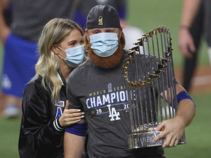 He was also seen holding the World Series trophy, which was likely handled by dozens of people involved with the championship-winning franchise.