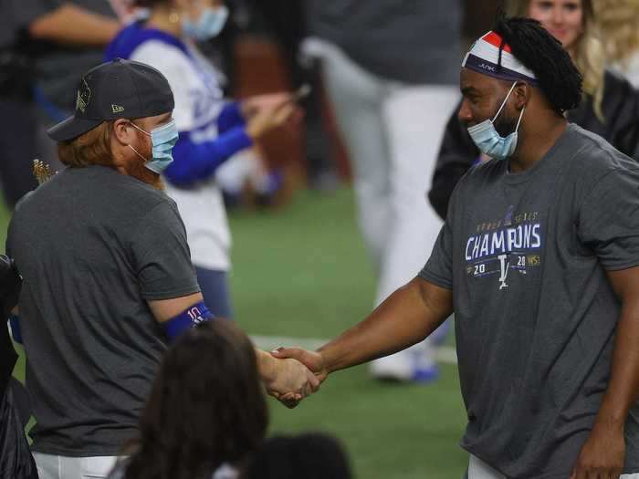 Turner was photographed shaking hands with teammate Pedro Baez ...