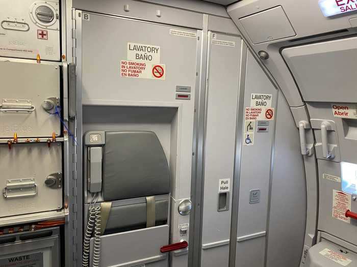 Speaking of the lavatory, the restyled aircraft also come with a reconfigured rear galley and smaller lavatories, the door to one is actually located behind a flight attendant jumpseat.