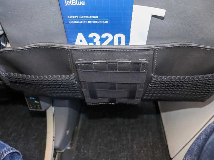 Even the seat-back pocket has a new look with three pockets in total and a device holder in the center.