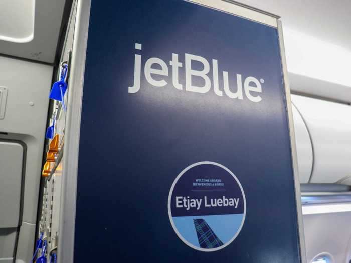 JetBlue branding is also more prevalent across the plane, starting with this welcome sign that tells passengers the name of the plane on which they