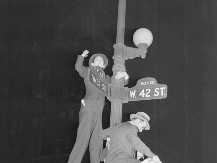 Some people even climbed lampposts in Times Square to celebrate the election.