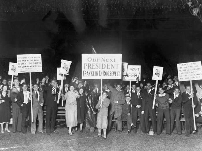 To celebrate election night, some people held up signs in the streets of Pittsburgh, Pennsylvania, to support Franklin D. Roosevelt in 1932.