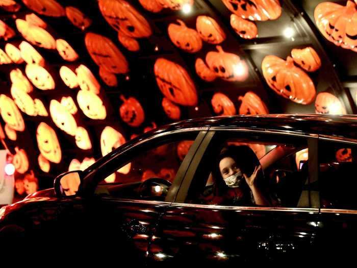 At the drive-thru, passengers can roll down their windows ...