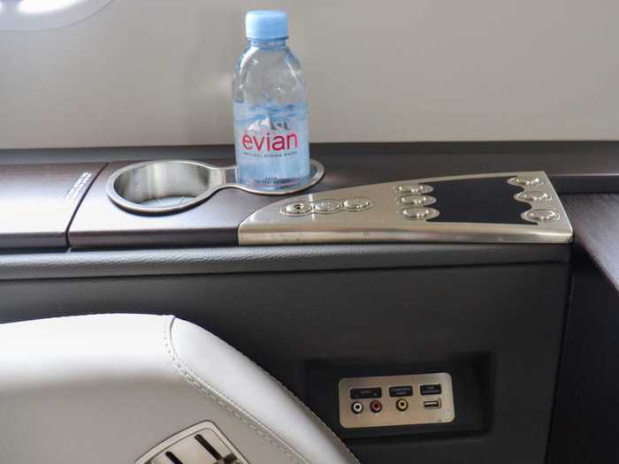 Each seat also comes with two cup holders, which the flight crew stocks with water bottles before each flight.