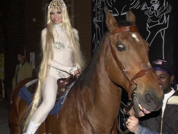 She arrived on horseback for her Lady Godiva costume the next year.