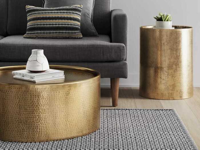 Add a metallic drum coffee table to your space to make it look more upscale.