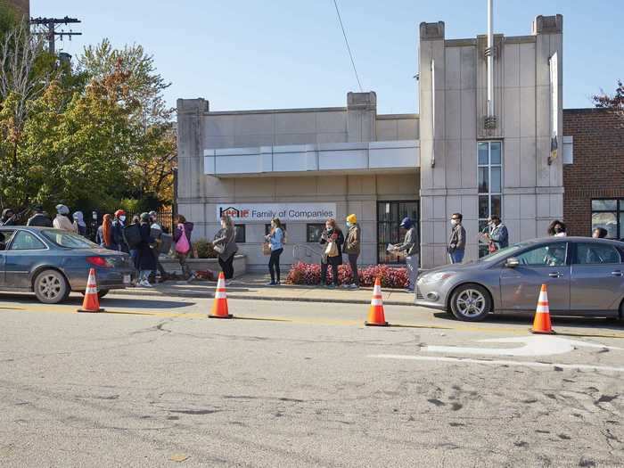 A large crowd of voters stand in line outside the Board of Elections in Cleveland, Ohio, on October 31, 2020.