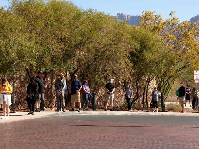 Early voting lines stretch down the sidewalk at Oro Valley Public Library in Tucson on October 30, 2020.