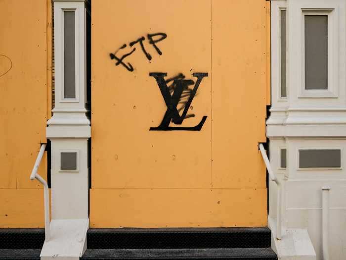 After Louis Vuitton stores reopened, some boarded up windows again during protests over the summer.