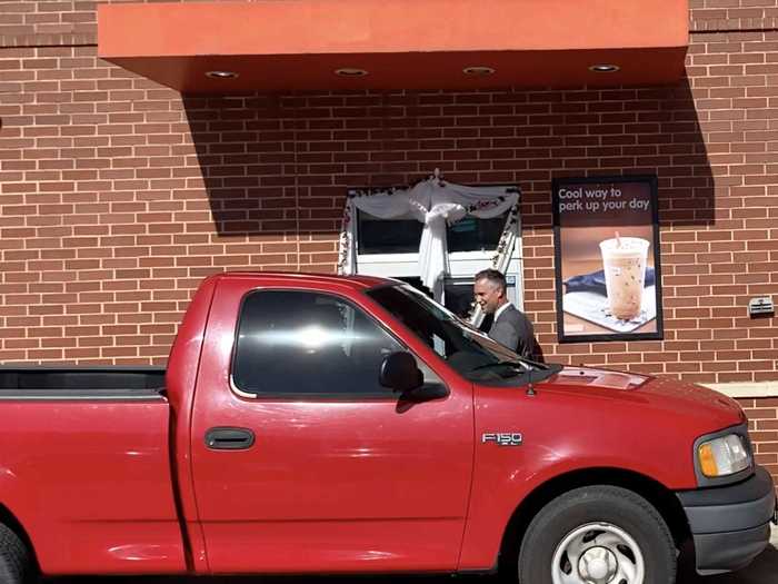 The couple both worked on the morning of their wedding day. And when it came time to say "I do," Thompson waited in line with all the other customers at the drive-thru.