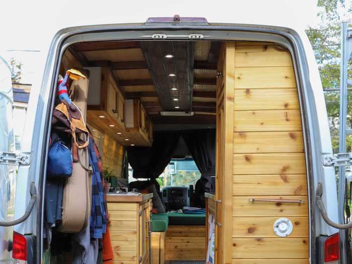 At the back of the van, there is a closet, which is unusual in a camper van.