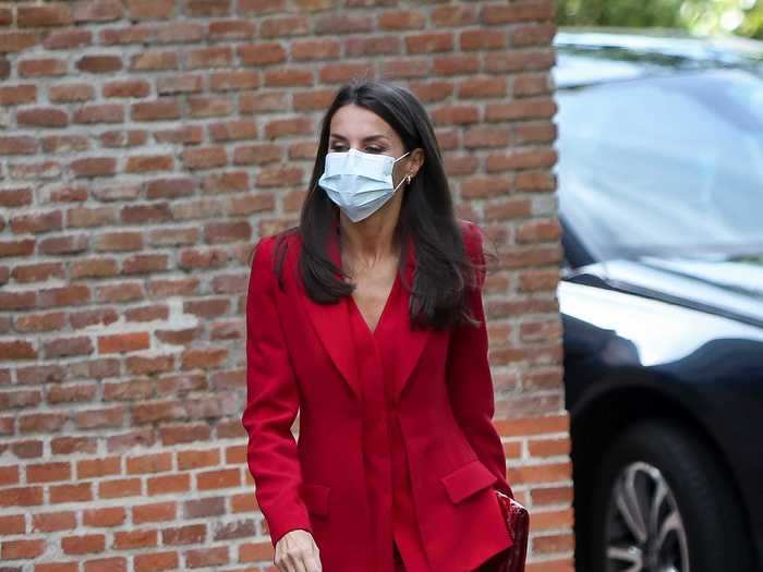 Queen Letizia wore a red suit designed by Roberto Torretta in October.