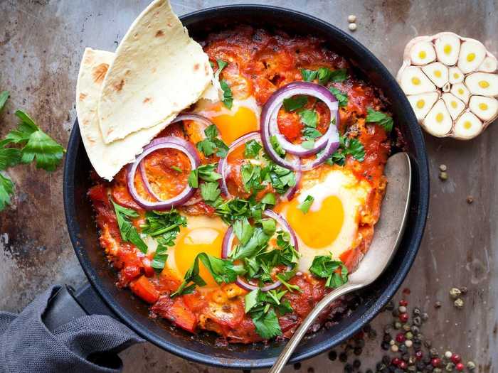 Upgrade your poached eggs by turning them into a shakshuka.