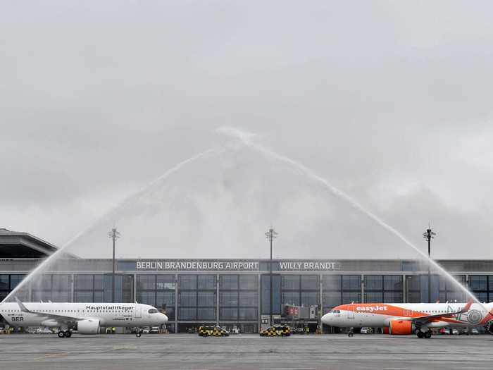 The Airbus A320neos parked face to face for the traditional water cannon salute, welcoming the airlines to the new airport.