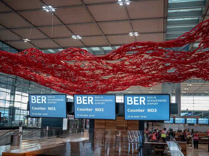 Hanging over the check-in area is an art installation called "The Magic Carpet" from an American artist Pae White.