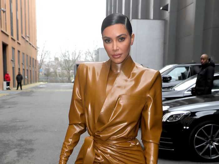 Kim Kardashian West attended Paris Fashion Week in a head-to-toe caramel latex outfit.