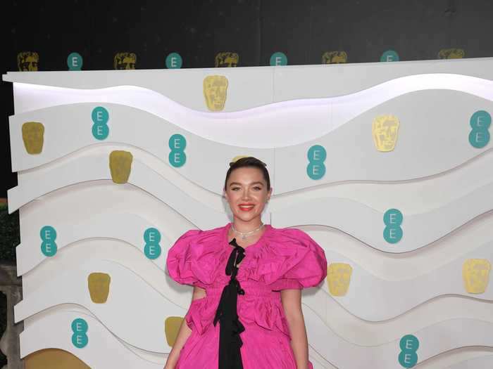 Florence Pugh wore an over-the-top fuchsia and black look at the 2020 BAFTAs.