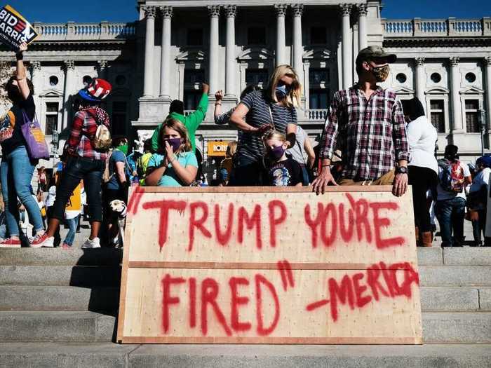 Another sign held by people in Harrisburg, Pennsylvania, referenced President Trump being "fired."