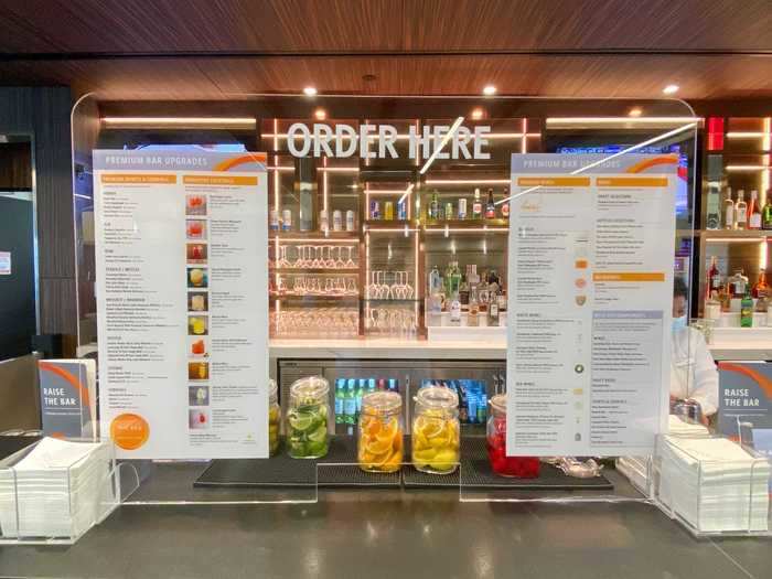 While patrons order behind a plexiglass partition that also features the drink menu so guests don