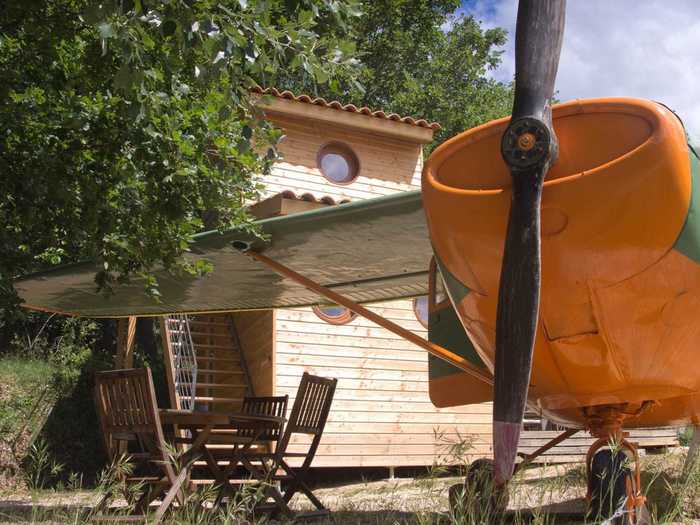 This Cessna is accompanied by a structure that