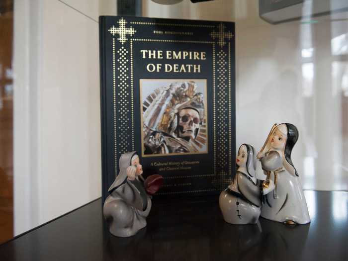 There are religious symbols and figurines placed throughout the home as a nod to the building