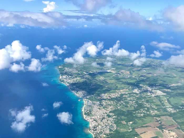 When we landed in Barbados, we were told to disembark row by row. As I was seated toward the back of the plane, this meant I was waiting on the tarmac for over half an hour.