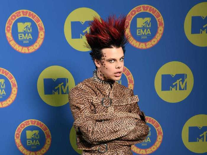 Yungblud posed in a cheetah-print straitjacket and matching pants.