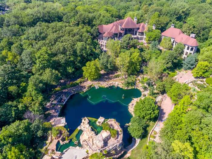 The home has a large pumping system that keeps the water clean, per the listing agents. Water from the tunnel, grotto, and waterfall feeds into a freshwater pond.