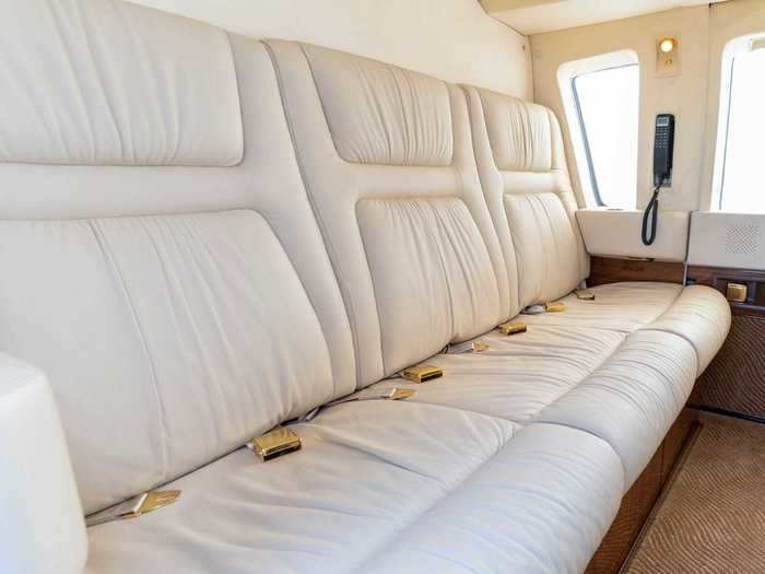 The divan is belted for four passengers but the center cushion can also fold down to create a table. There