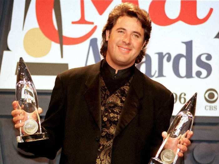 Vince Gill wore a gold brocade vest under his suit jacket while hosting the 1996 CMA Awards.