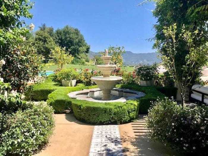 Several fountains are also incorporated into the landscaping, as seen in images of the home.